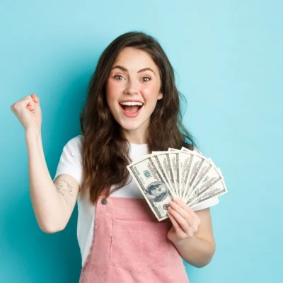 excited-smiling-girl-fist-pump-and-hold-money-priz-2023-11-27-04-54-37-utc_resize